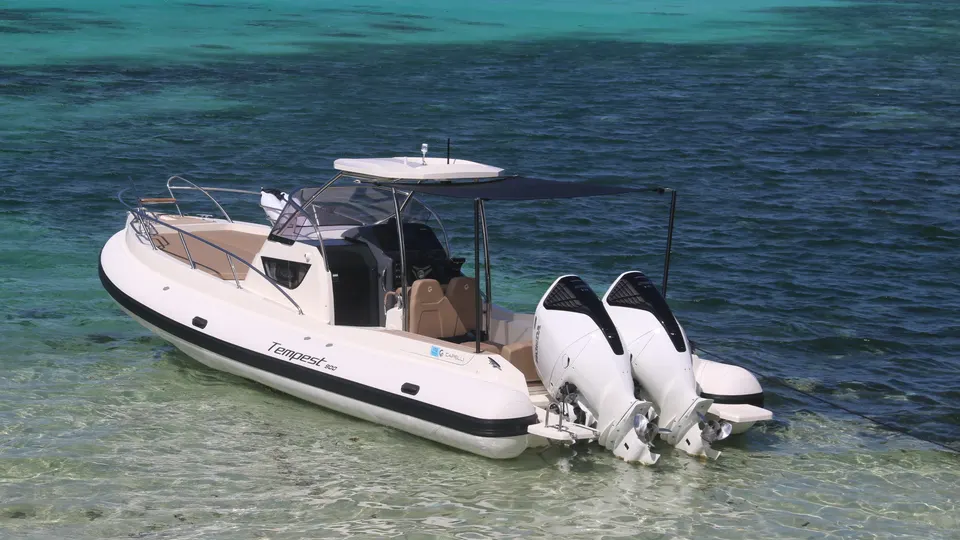 The AUREA I lying in turquoise shallows near a beach