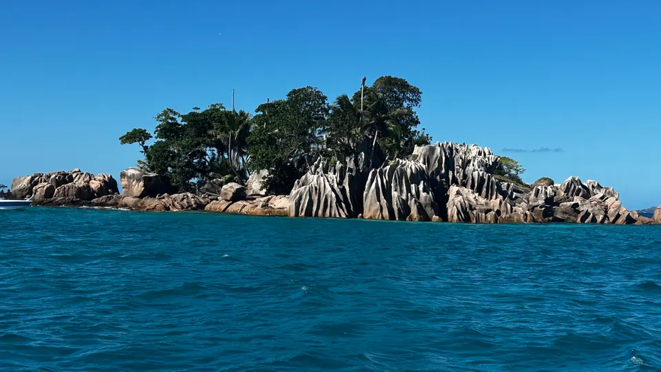 The granite spires of Saint Pierre island rising from turquoise water