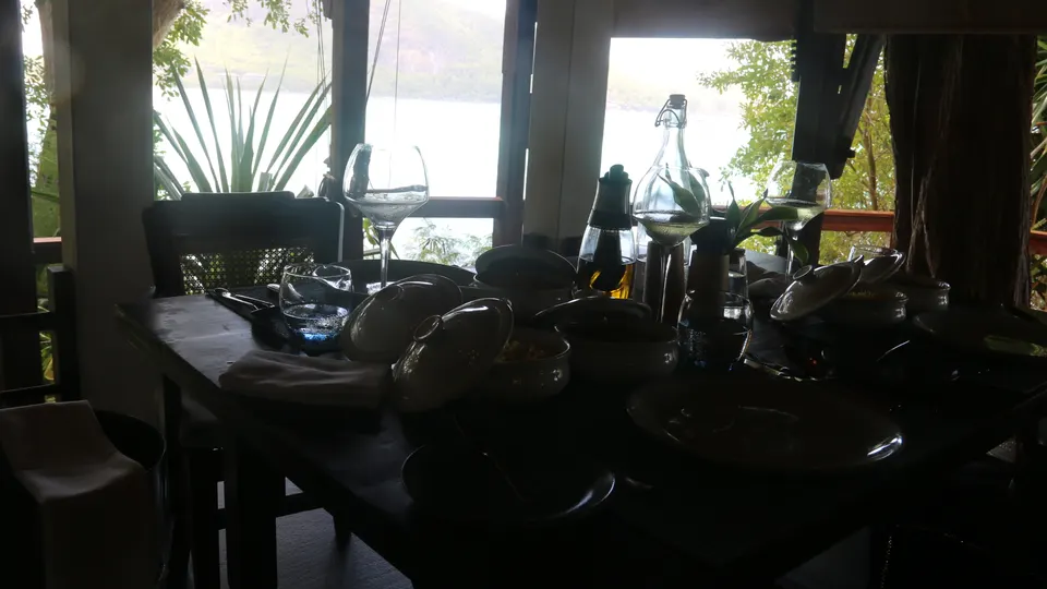 A table set for lunch, open to the lagoon